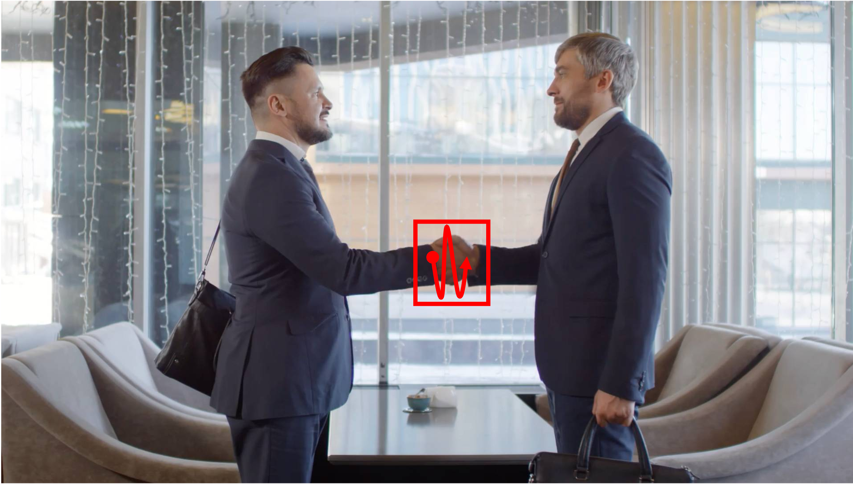 Two people in professional suits standing in the same place and shaking hands. The camera remains static in a place. Camera remains stationary. Static Camera. Camera locked down at the same place. The video loops back to the beginning of the video after it reaches the end.
